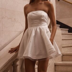 Showpo Cailene Mini Dress - Strapless Bow Train Fit and Flare Dress with Pearls